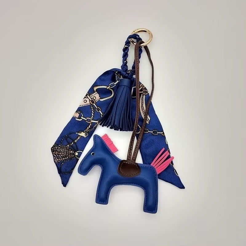 PONY BAG CHARM WITH SCARF AND TASSEL