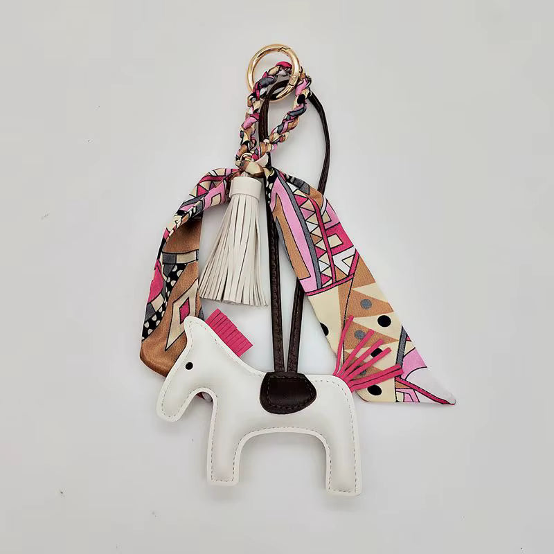 PONY BAG CHARM WITH SCARF AND TASSEL