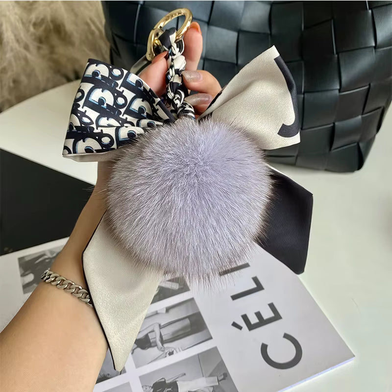 BOWED POMPOM CHARM