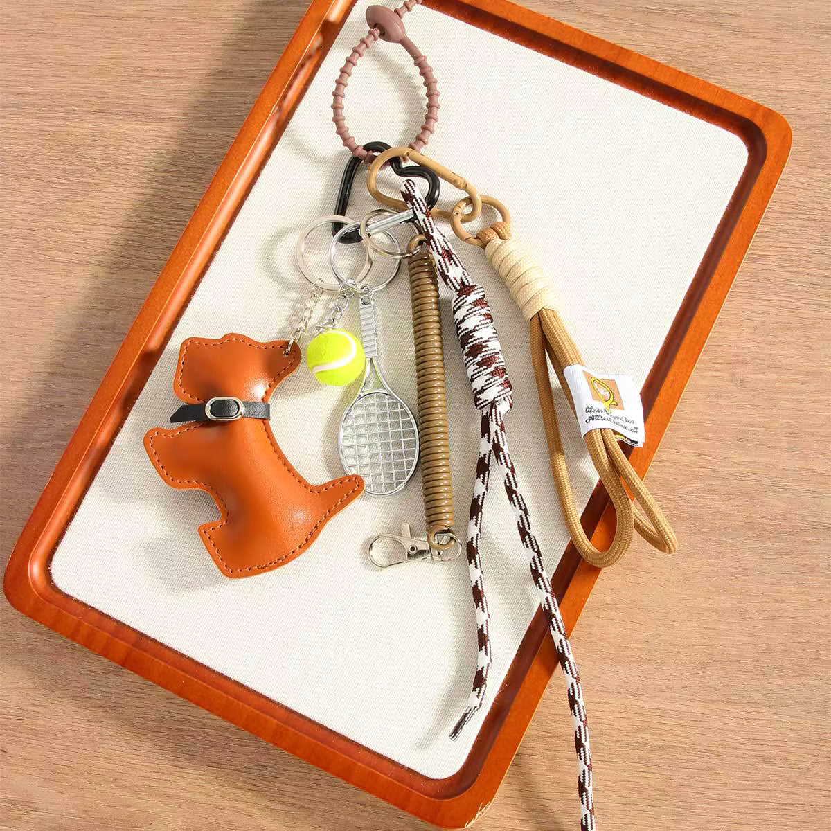 CARTOON DOG SPORTS TASSEL CHARM